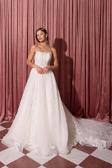Off-white strapless wedding dress front view with lace and flowing train