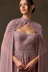 Close-up mauve sweetheart beaded evening gown and shoulder cape