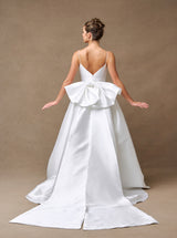 Off-white bridal ball gown back view with removable oversized bow