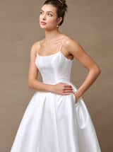 Off-white wedding gown close-up of scoop neckline and fitted bodice