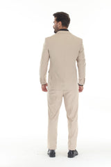 Tan three-piece peak lapel wedding tuxedo back